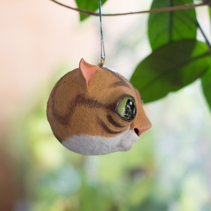 a picture of a cat ornament. the colour is not so lustre as the one on the dinosaur bauble
