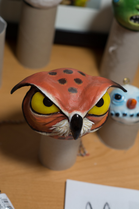 the painted owl ornament looking into the camera. It is one angry bird!
