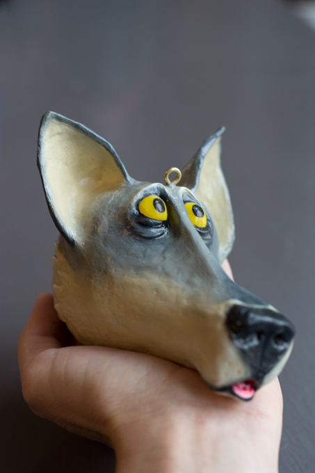 the wolf ornament painted, looking in one direction